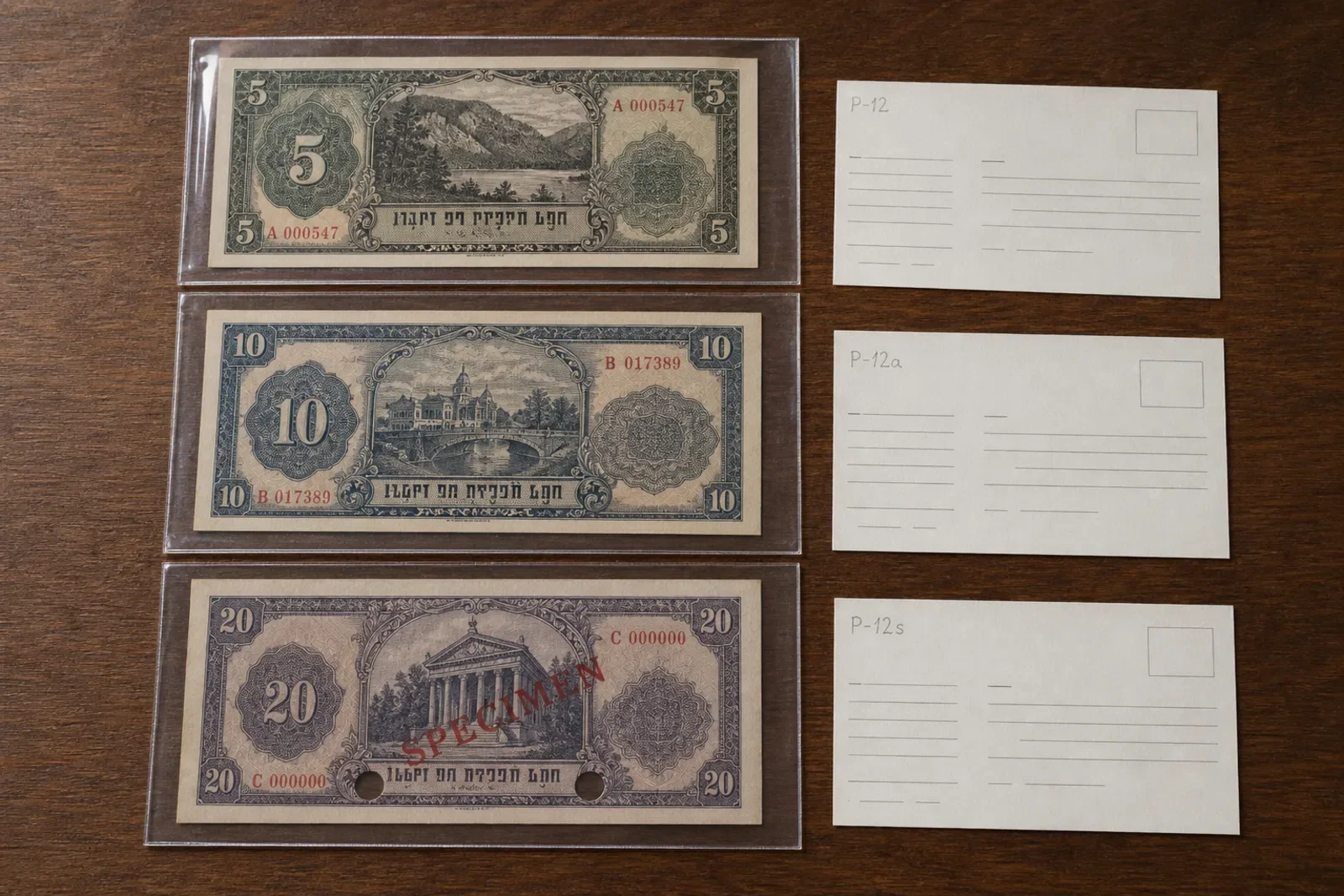 Three fictional banknotes beside catalog cards marked P-12, P-12a, and P-12s